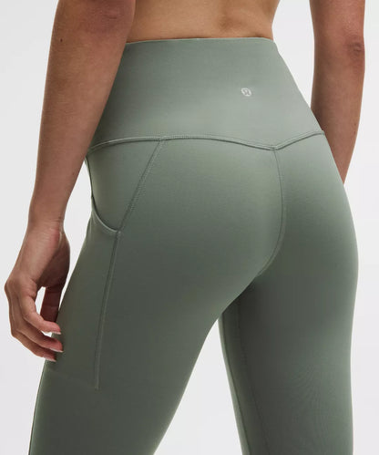Green leggings worn by a person on a white background