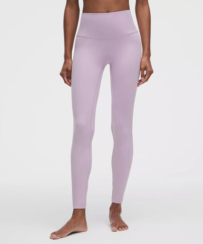 Person wearing lavender leggings on a white background