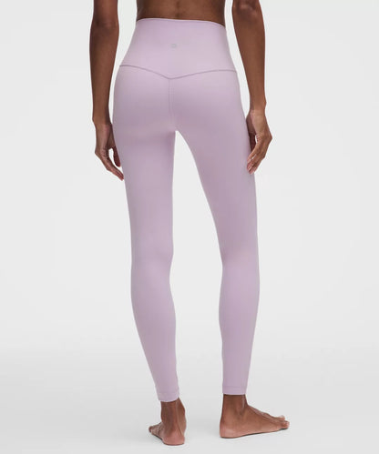 Person wearing light purple leggings on a white background