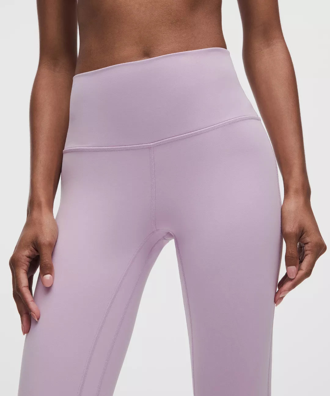 Lavender leggings worn by a person on a plain background
