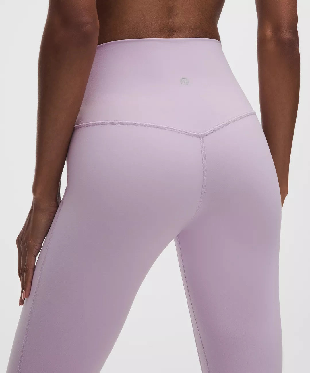Lavender leggings worn by a person on a white background