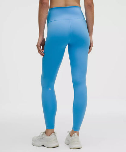Person wearing bright blue leggings on a white background