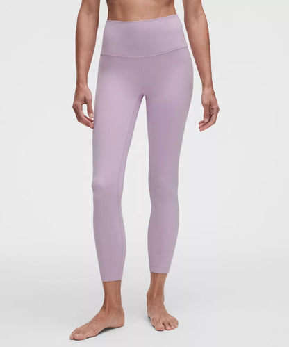 Person wearing light purple leggings on a white background
