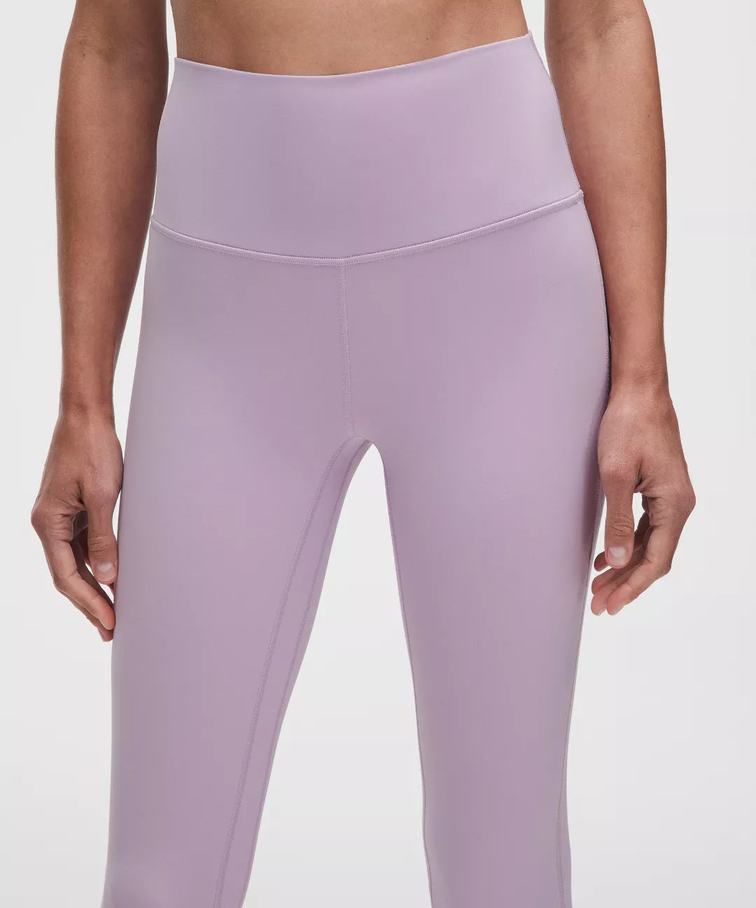 Lavender leggings worn by a person on a plain background