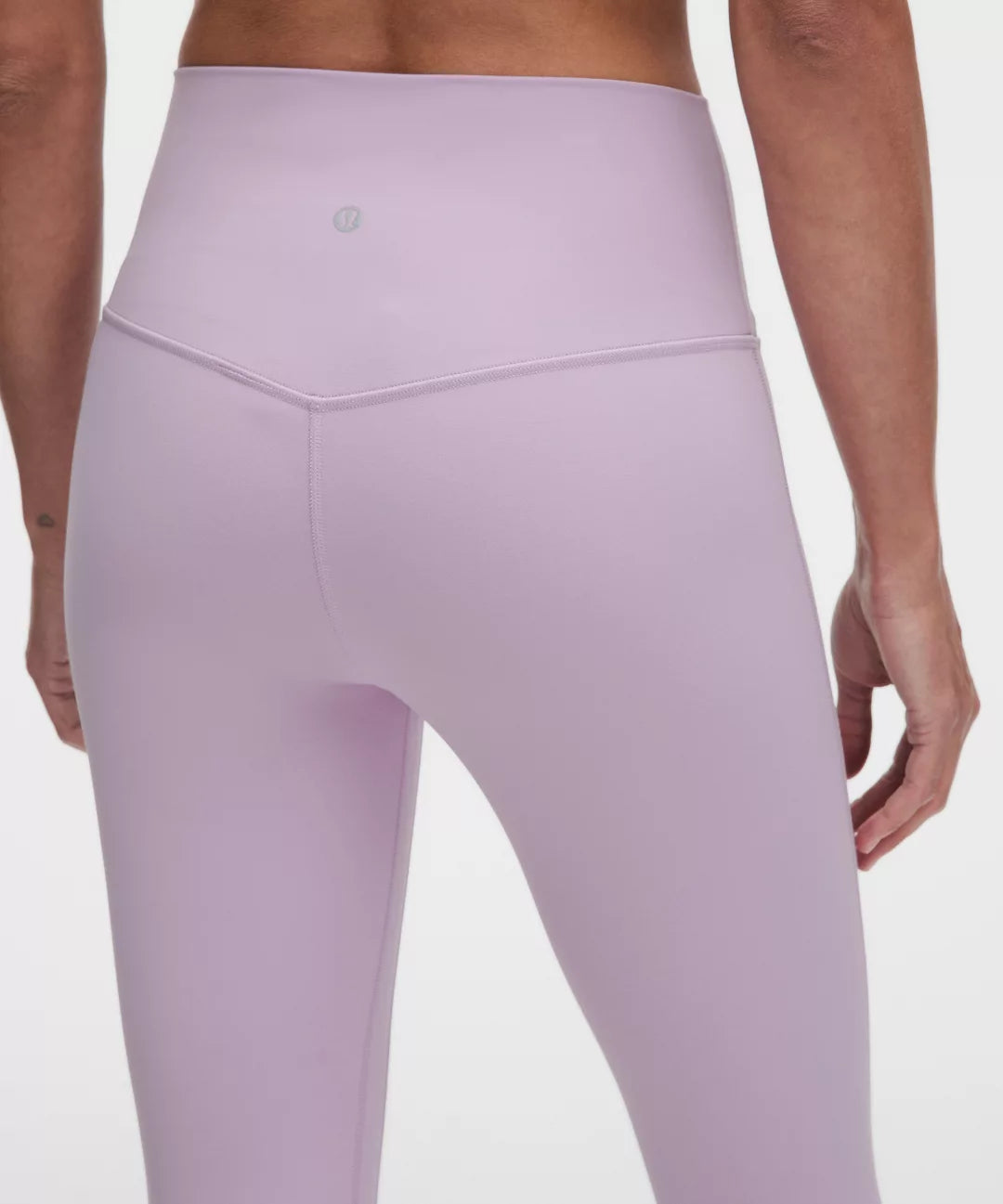 Lavender leggings worn by a person on a white background