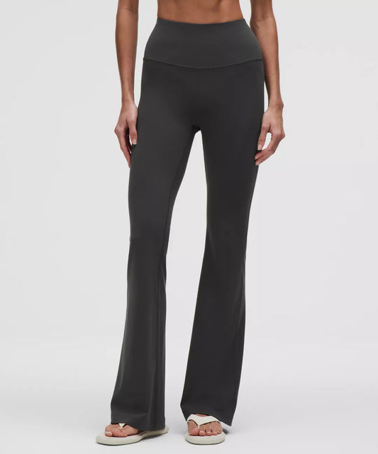 Black leggings worn by a person on a white background