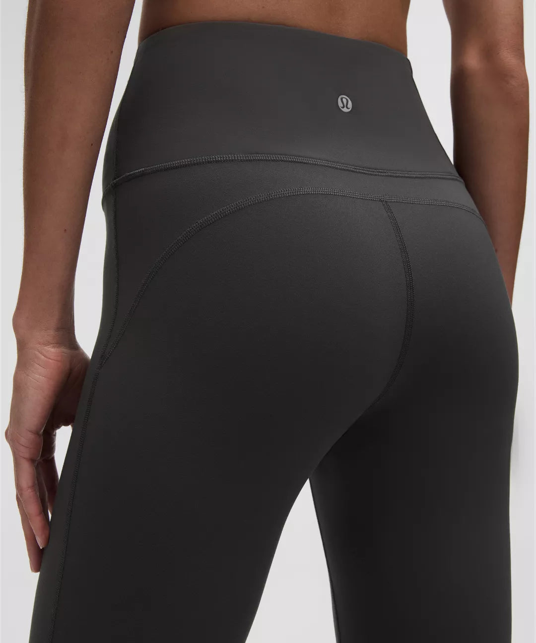 Black leggings worn by a person on a white background