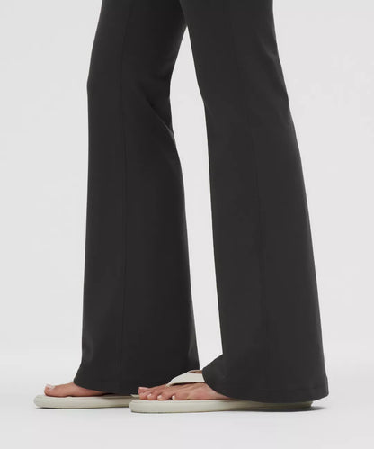Black wide-leg pants worn by a person on a white background