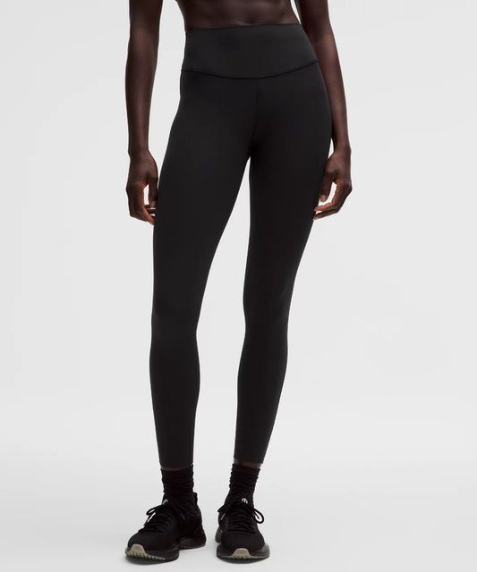 Person wearing black leggings on a white background