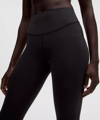 Black leggings worn by a person on a white background