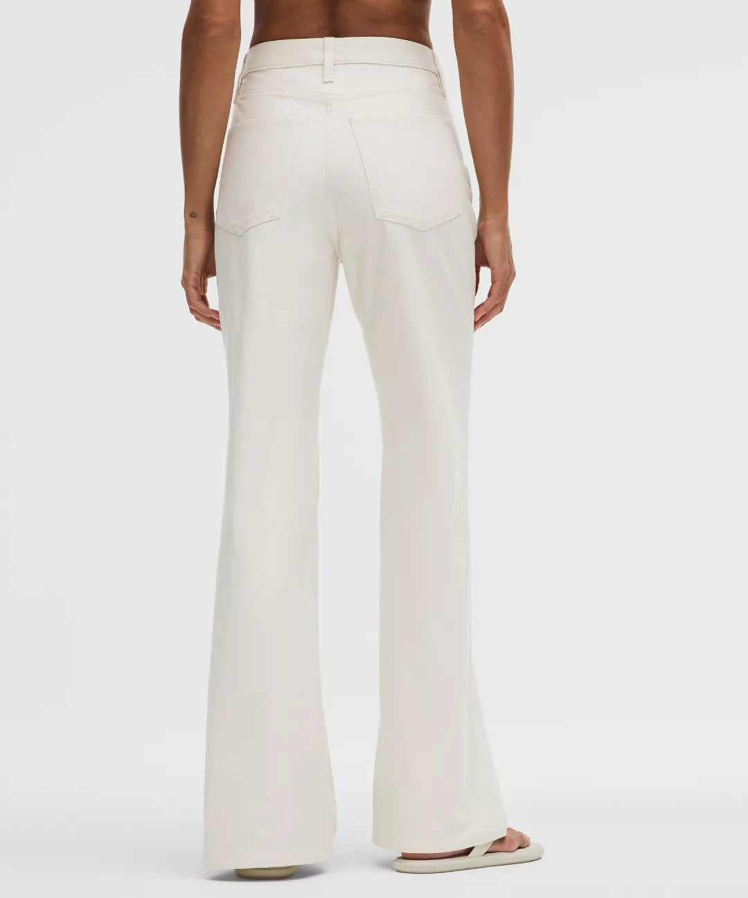 White wide-leg pants worn by a person on a white background