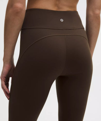 Brown leggings with a brand logo on a white background
