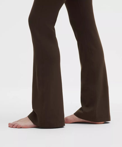 Brown pants worn by a person on a white background