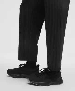 Black dress shoes and pants on a white background