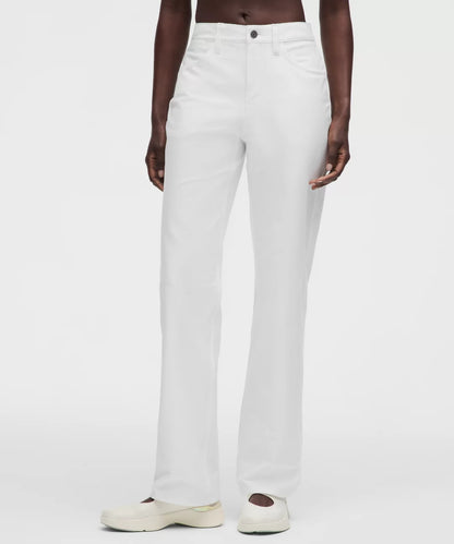 Person wearing white pants on a plain background