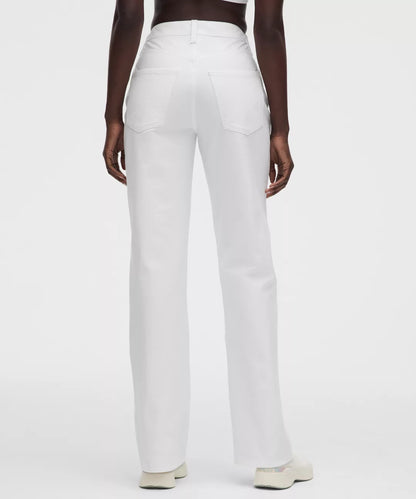 White pants worn by a person on a white background