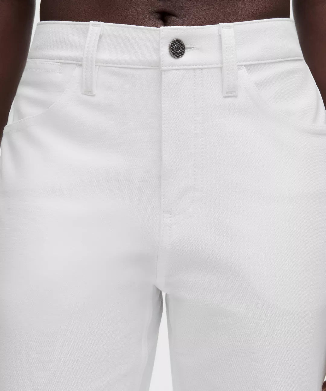 White pants with a button detail on a white background