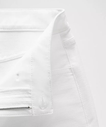 Close-up of a white jacket with zippers on a white background