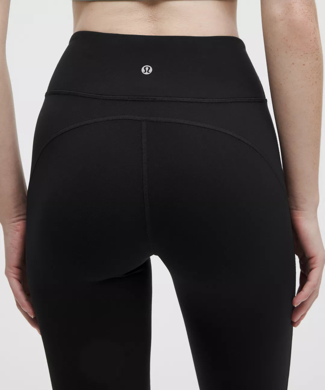 Black leggings with a brand logo on a white background
