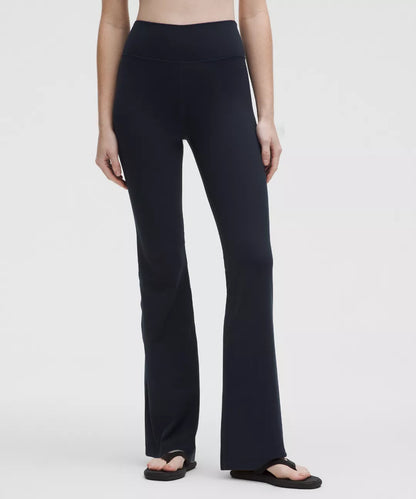 Person wearing black pants on a white background