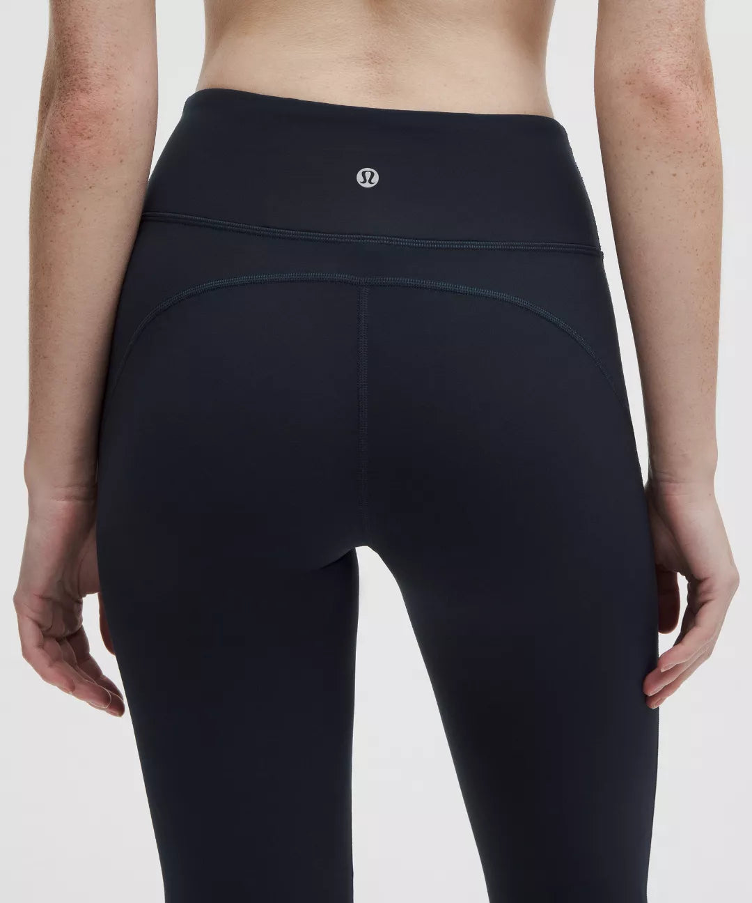 Black leggings with a brand logo on a white background
