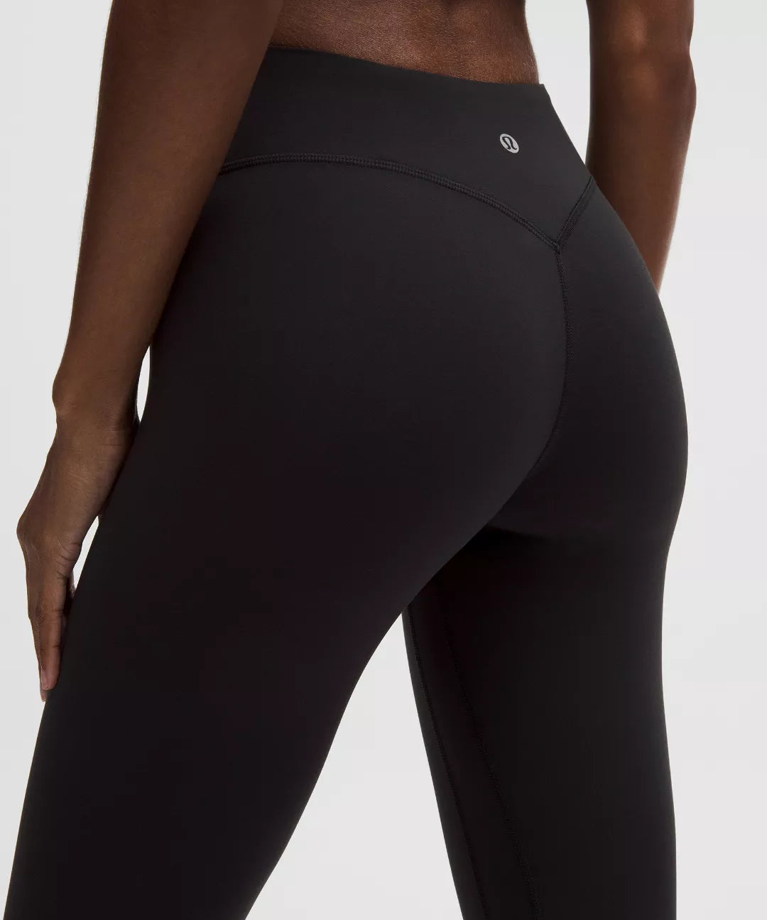 Black leggings worn by a person on a white background