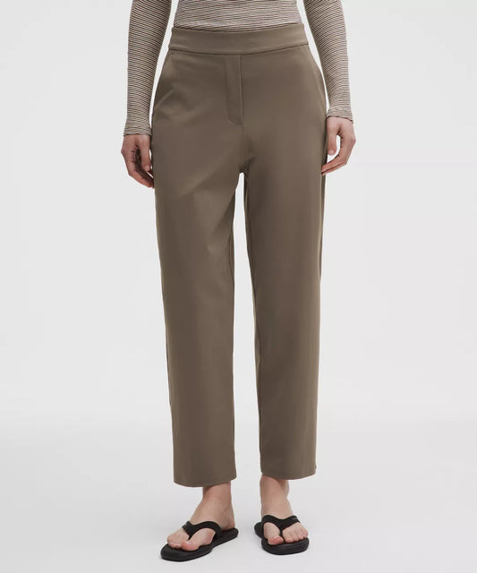Person wearing brown pants on a white background