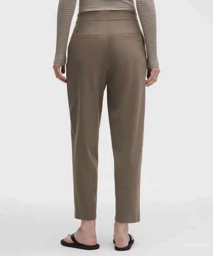 Person wearing brown pants on a white background