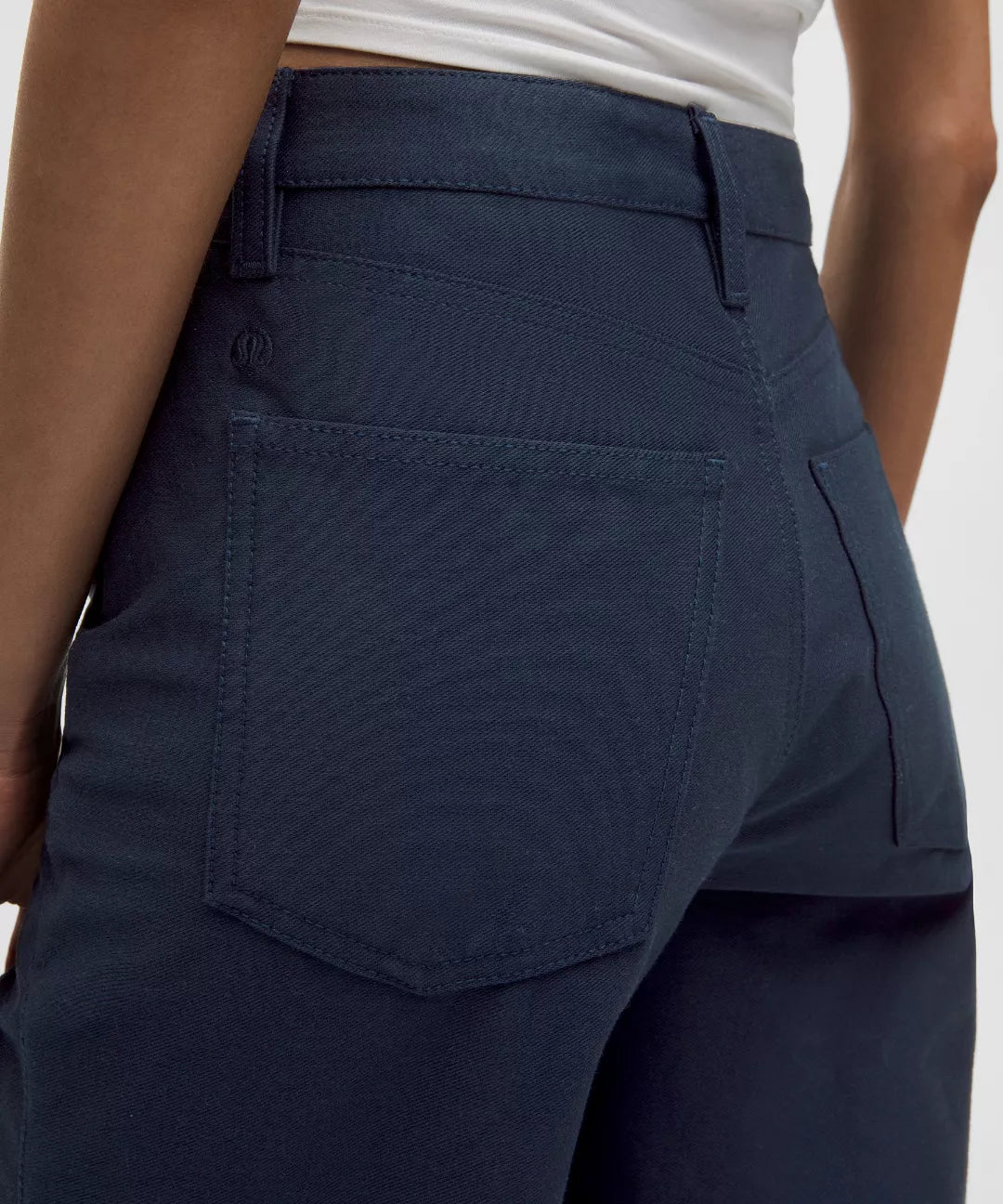 Navy blue pants with a white background