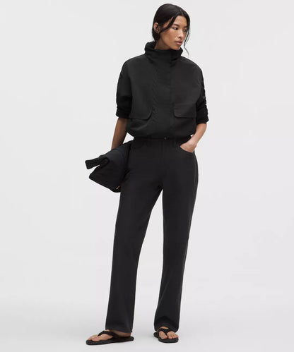 Person wearing a black outfit on a white background