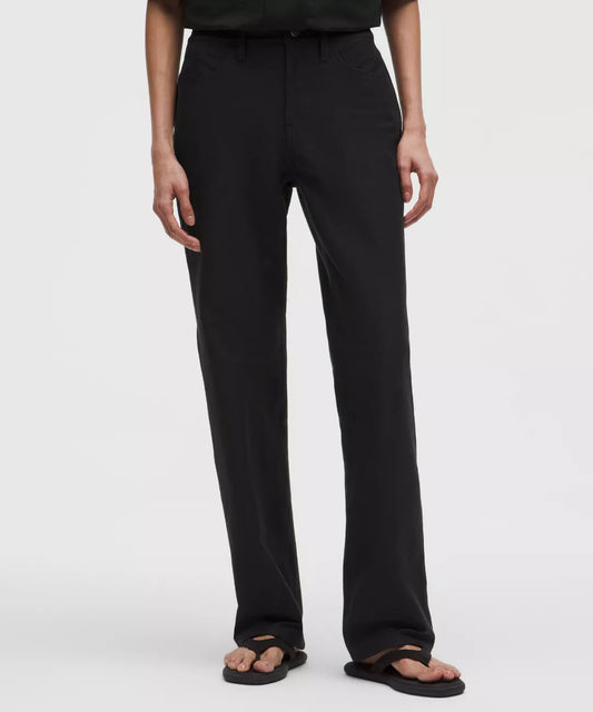 Person wearing black pants on a white background