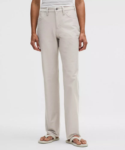 Person wearing beige pants on a white background