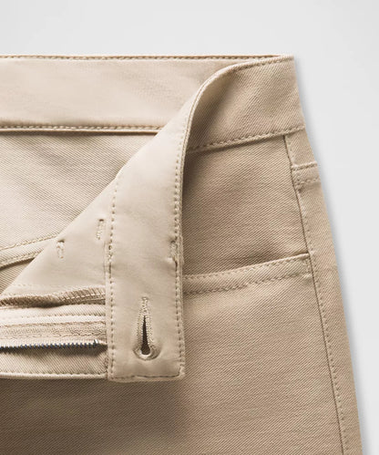 Close-up of beige pants with a white background