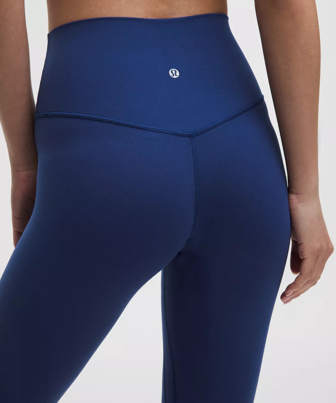 Blue leggings with a brand logo on a white background