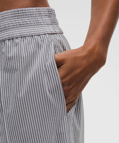 Gray striped pants with a white background