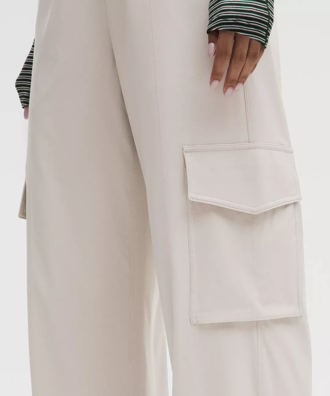Beige cargo pants with a white background