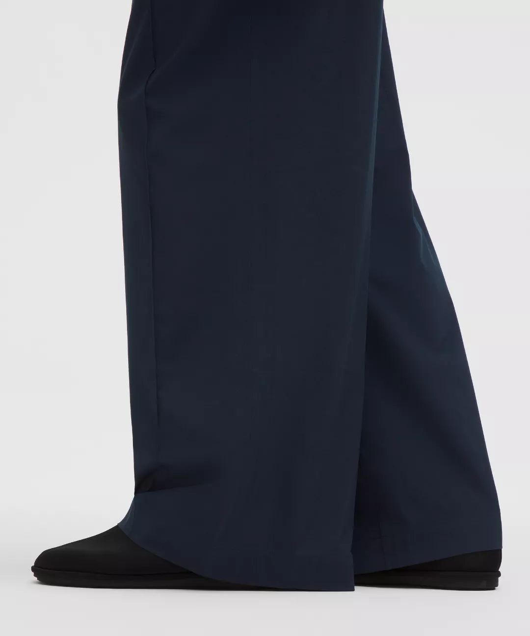 Navy blue wide-leg pants on a white background