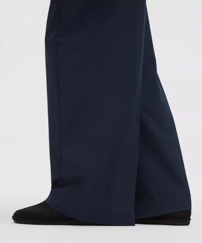 Navy blue wide-leg pants on a white background