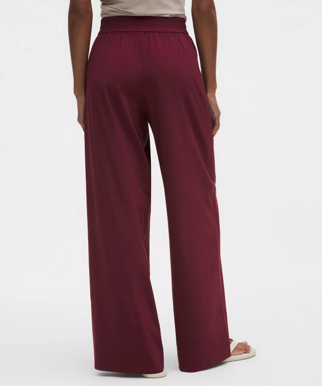 Maroon wide-leg pants worn by a person on a white background