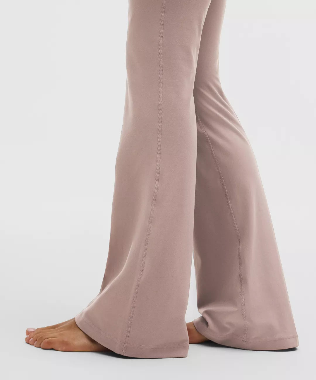 Light brown pants worn by a person on a white background
