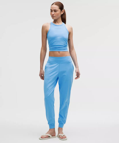 Woman wearing a blue athletic outfit on a white background