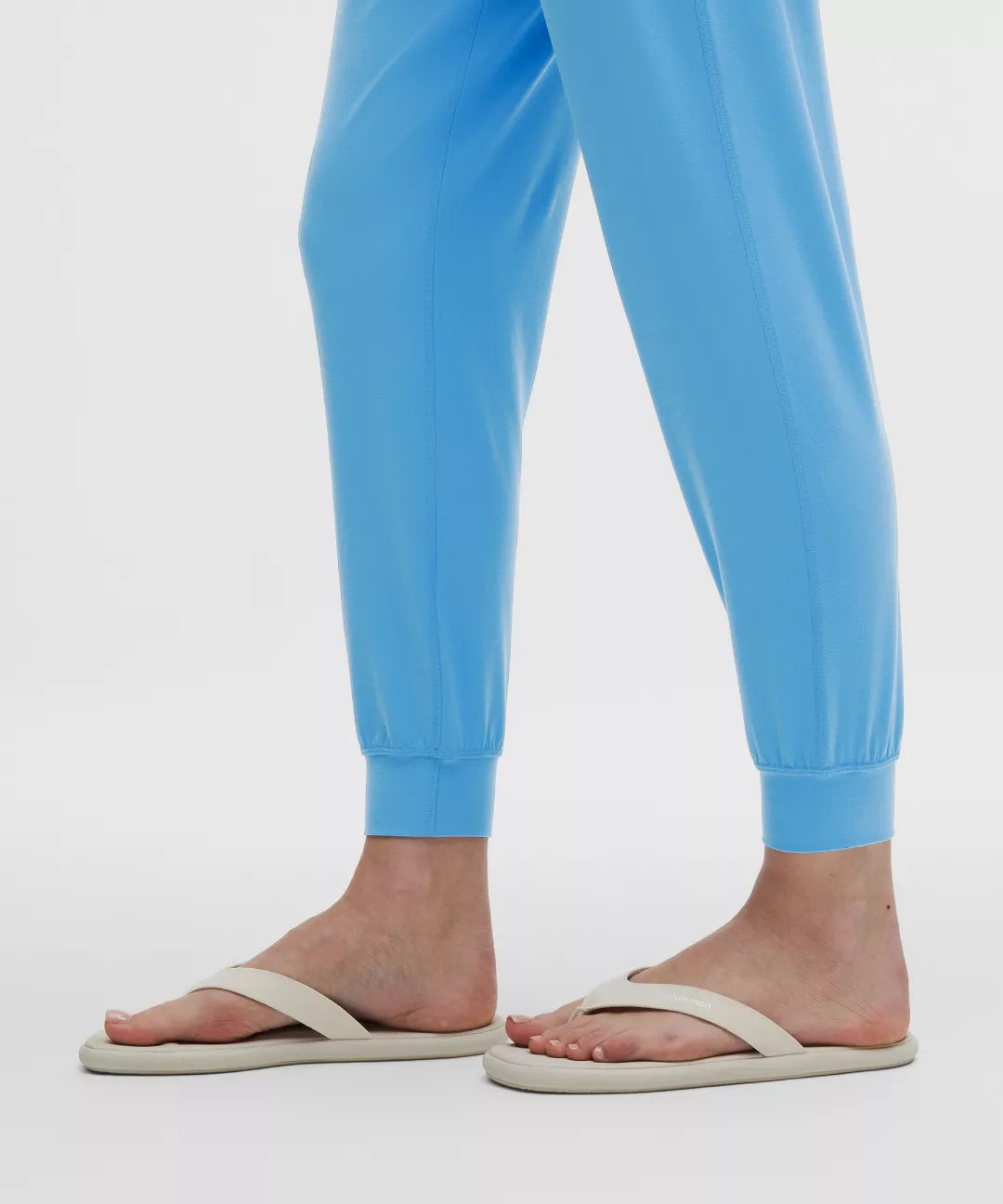 Light blue pants worn by a person on a white background