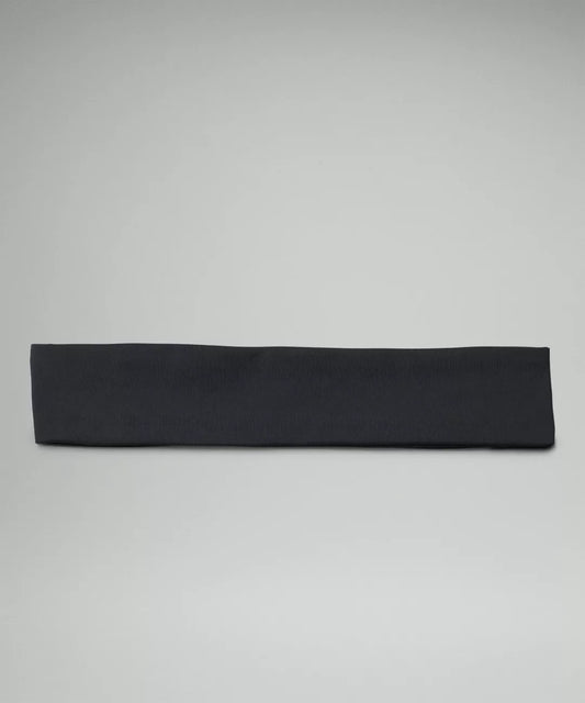 Black headband on a light gray background