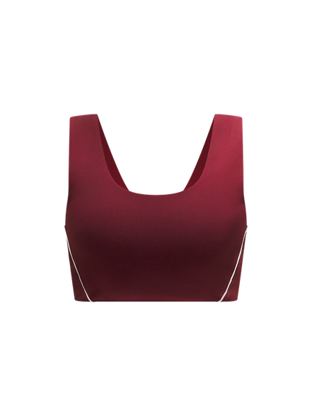 Red crop top with thin straps on a white background