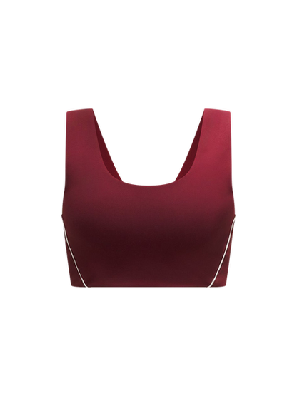 Red crop top with thin straps on a white background