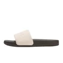 Black sandal with a white sole on a white background